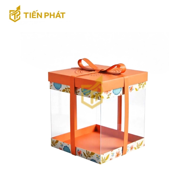 Hộp bánh kem trong suốt, màu cam, họa tiết hoa và lá