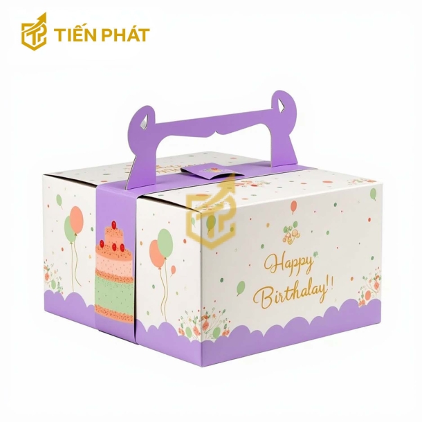 Hộp bánh kem vuông màu trắng in hình bong bong, bánh kem và chữ "Happy Birthday"