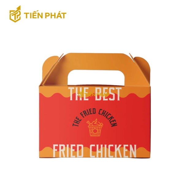 Hộp giấy đựng gà rán, màu đỏ cam, chữ "The best fried chicken"