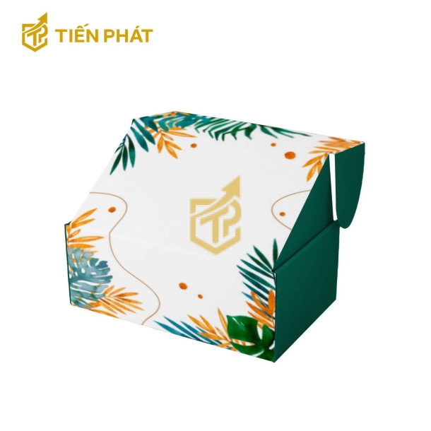 Hộp giấy đựng quần áo màu trắng và xanh, họa tiết lá cây